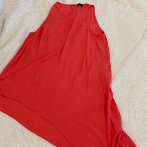 BCBG sleeveless blouse with longer hem on one side. Very flattering.